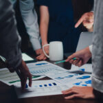 Millennial Asia businessmen and businesswomen meeting brainstorm